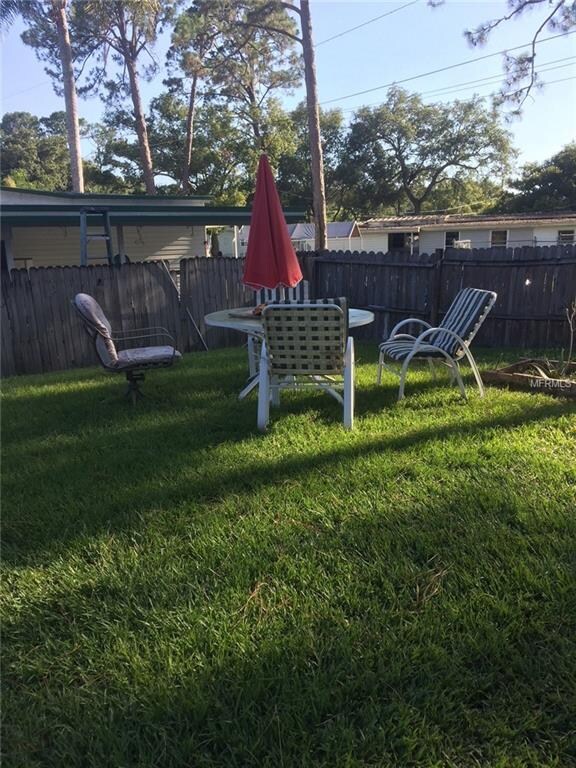 Large yard within fenced area. No HOA, no age rest