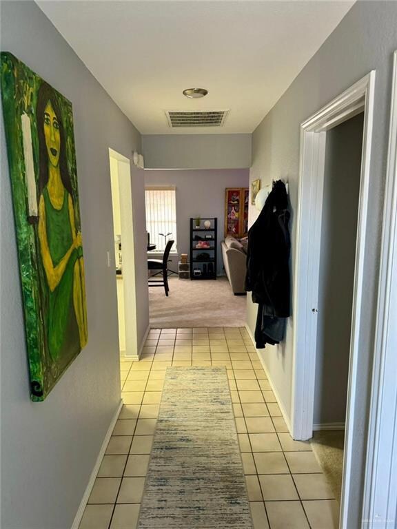 Hallway with light carpet