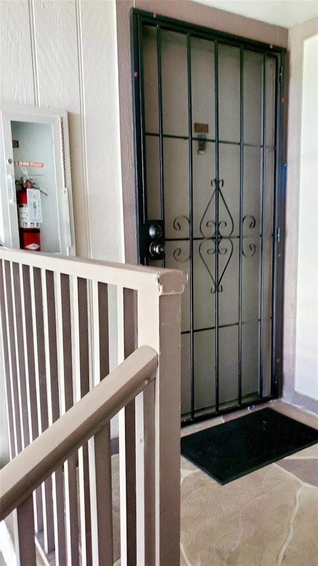 Front Door with additional iron gate door with lock.