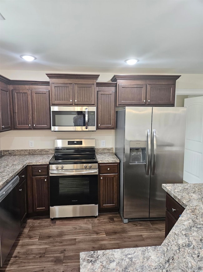Kitchen featuring appliances with stainless steel 