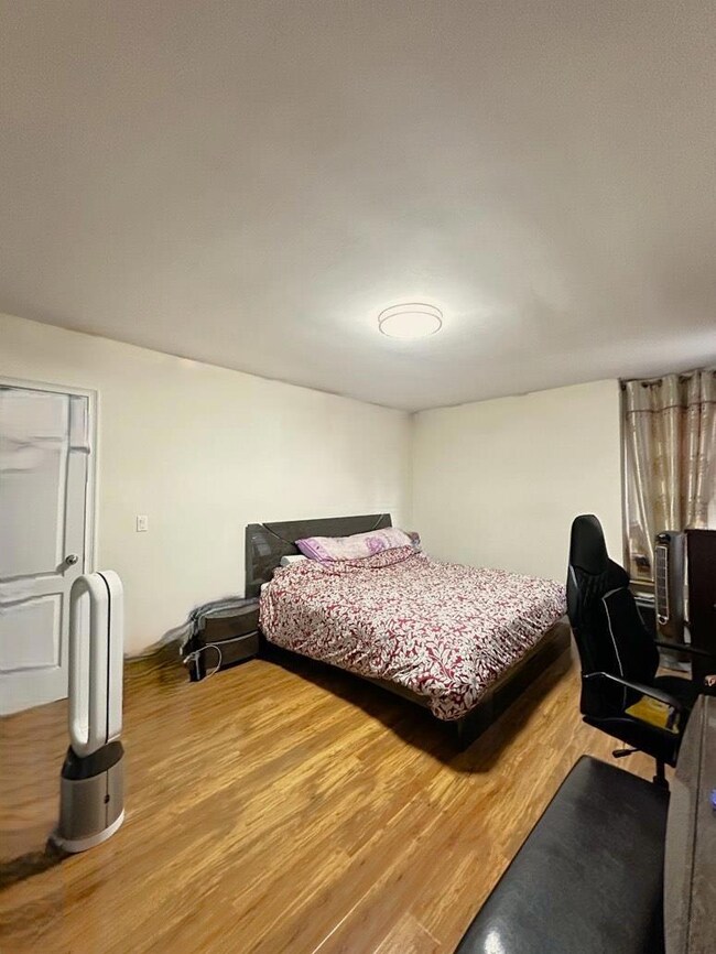 Bedroom featuring wood finished floors