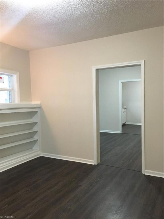 View from living room, into dining room, through to the kitchen
