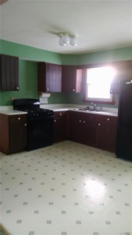 Kitchen with view of back yard over sink