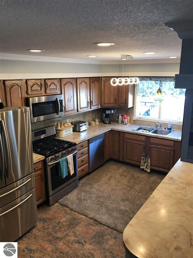 The kitchen is open to the dining area and boasts 
