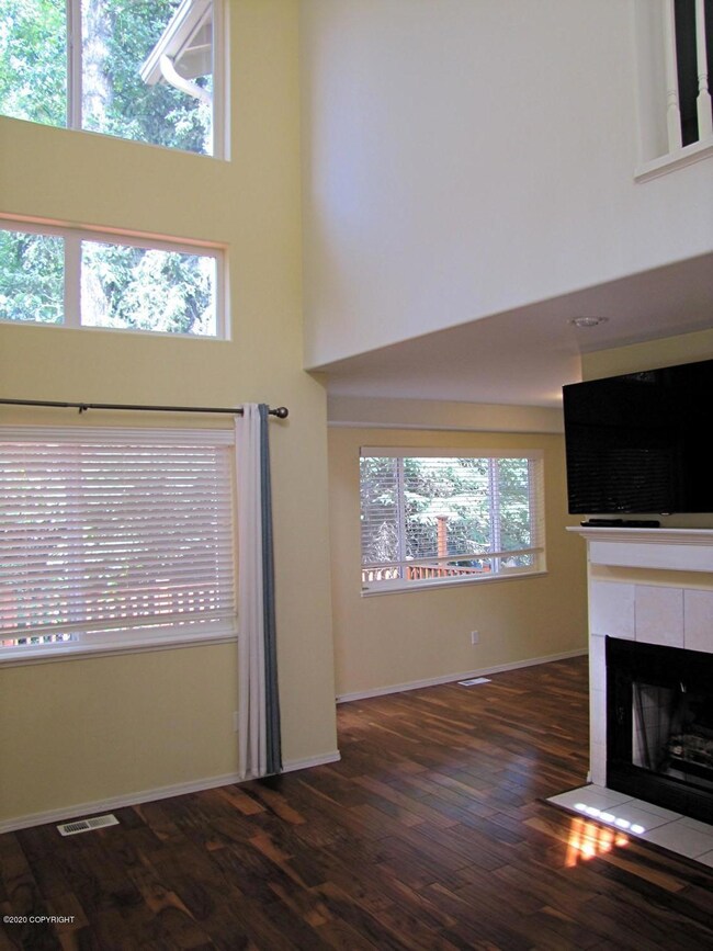 Wall of windows in living room.