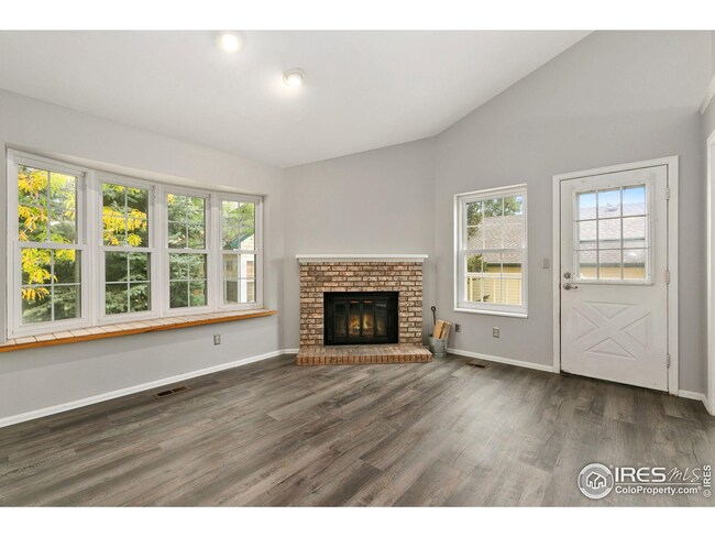 New LVP flooring, updated windows and wood-burning fireplace.