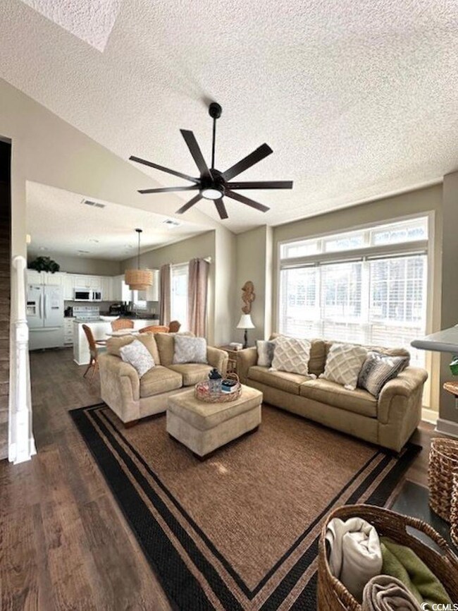 Living area with plenty of natural light, vaulted 