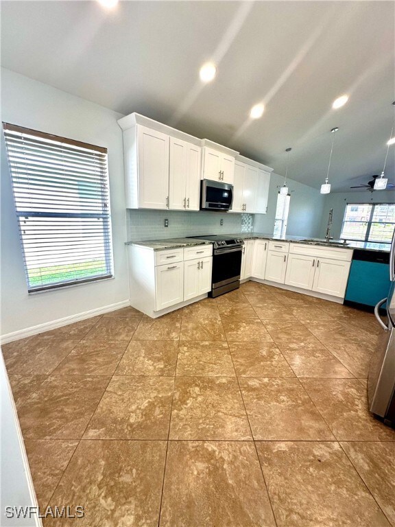Kitchen featuring appliances with stainless steel