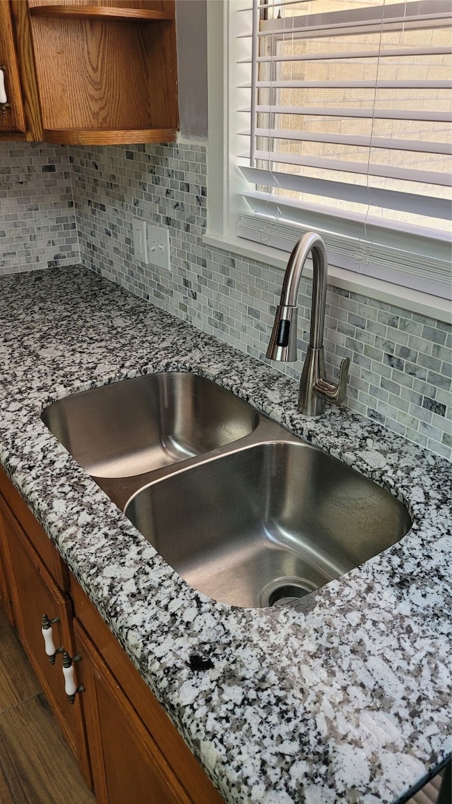 All new polished granite counters & backsplash rea