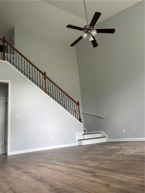 Unfurnished living room featuring stairway, ceilin