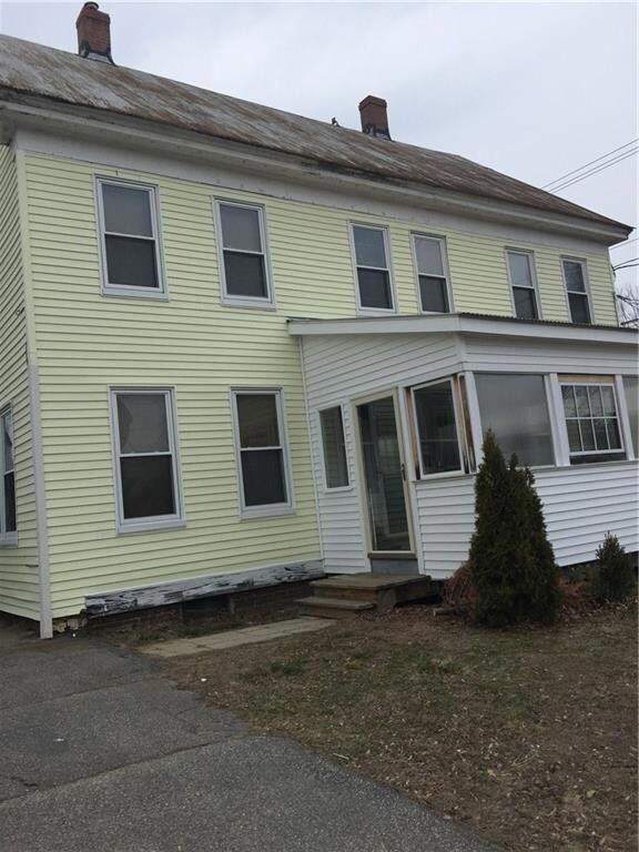 Enclosed front porch serves as extra...