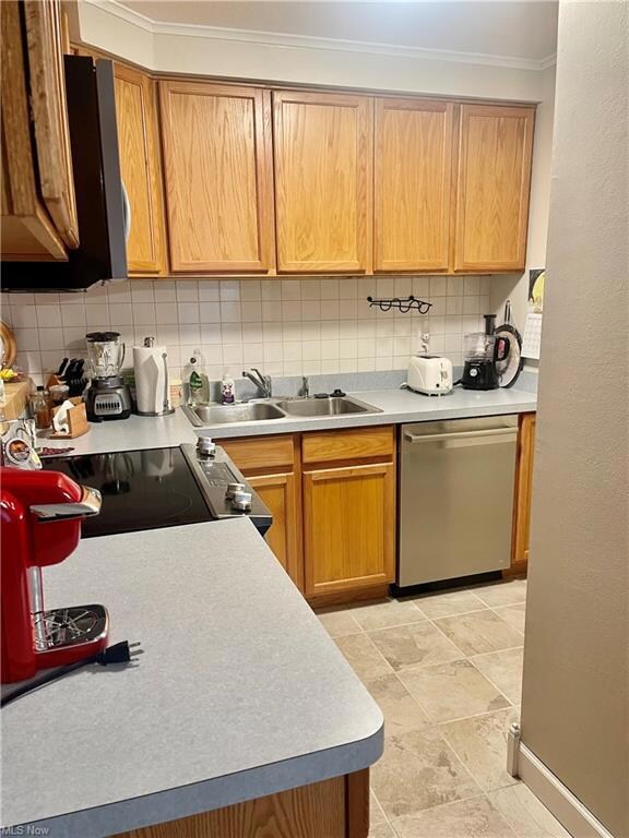 Kitchen with range, tasteful backsplash, dishwashe