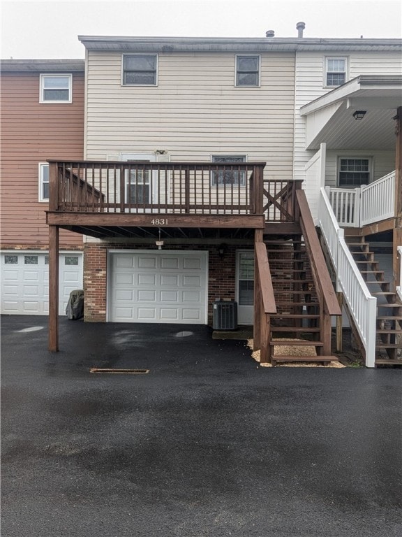 Back of Condo with Deck and additional parking spa