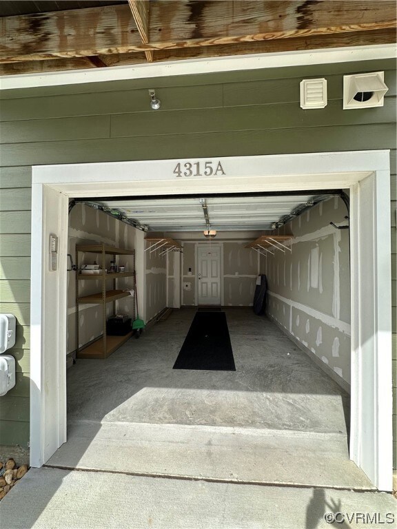Garage with a garage door opener and build in shel