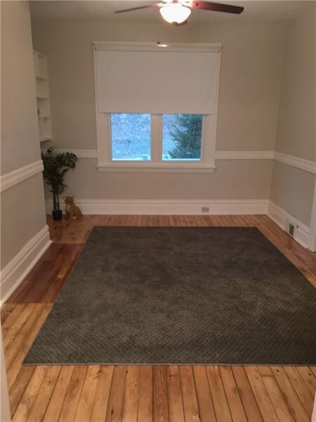 Living Room features pine hardwood floors and orig