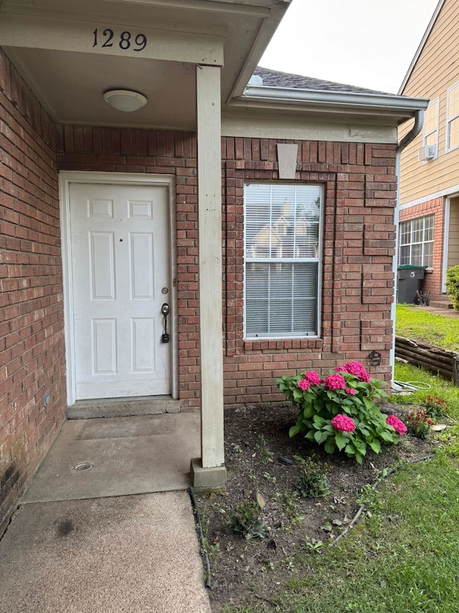 Property entrance with brick siding