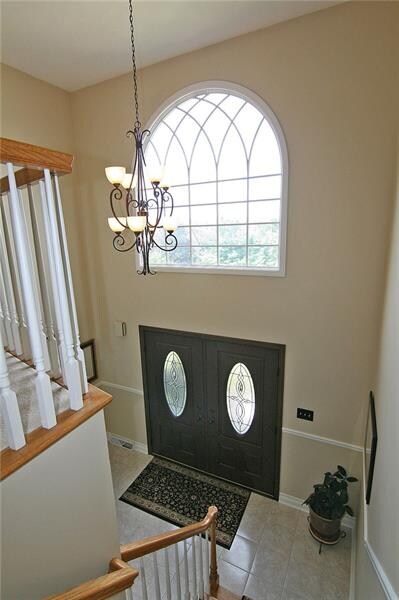 Sun-bathed two-story entry!  Setting a tone of cas