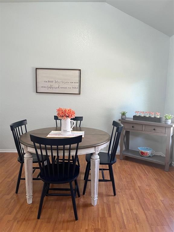 Dining area featuring wood finished floors and baseboards