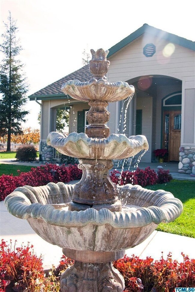 Front of home with the water flowing.