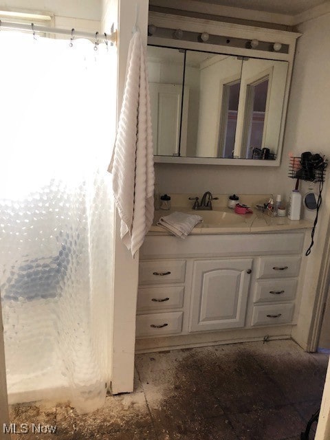 Bathroom featuring vanity and a shower with curtain