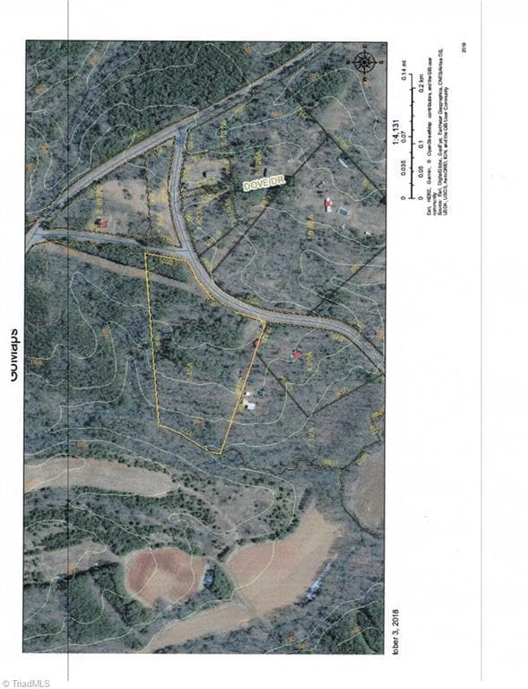 Aerial shows power lines easement through the property