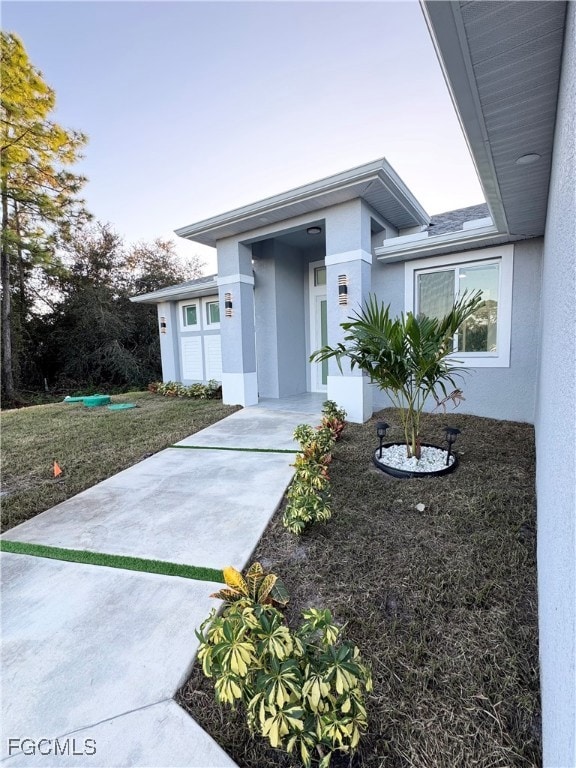 Prairie-style home featuring stucco siding