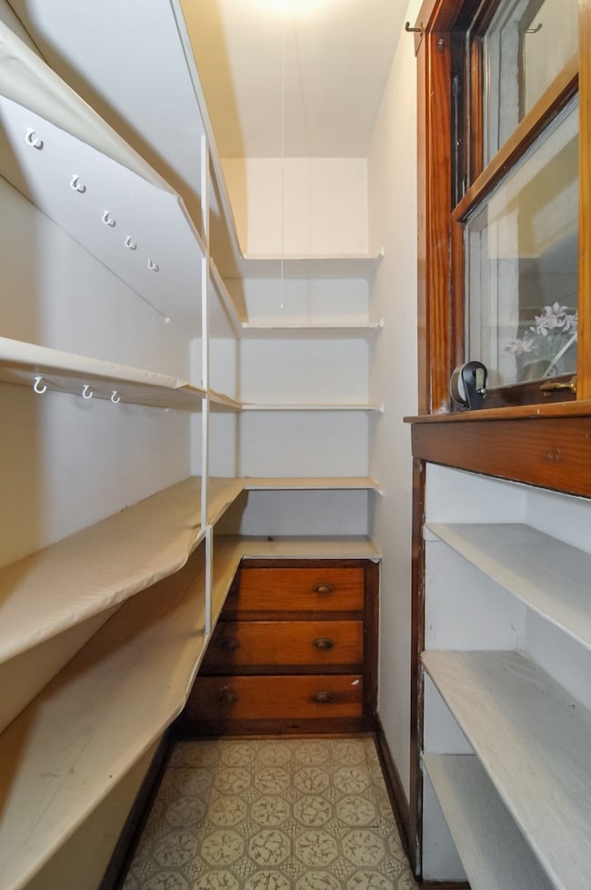 Lovely walk in pantry featuring original built-in 