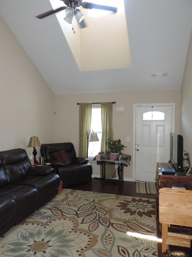 Great room features extra natural light from upstairs window.