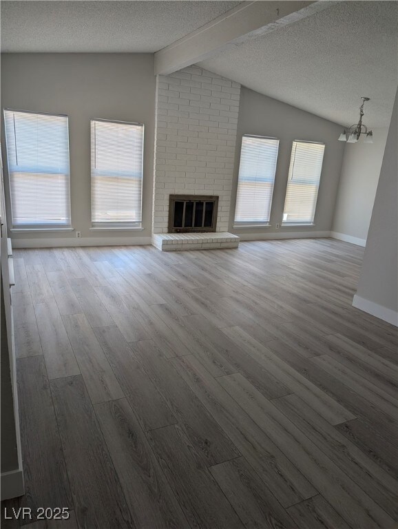 Unfurnished living room with wood finished floors,