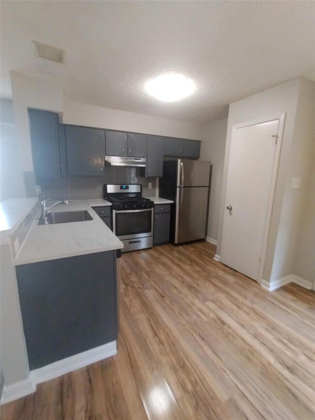Kitchen with a sink, appliances with stainless st
