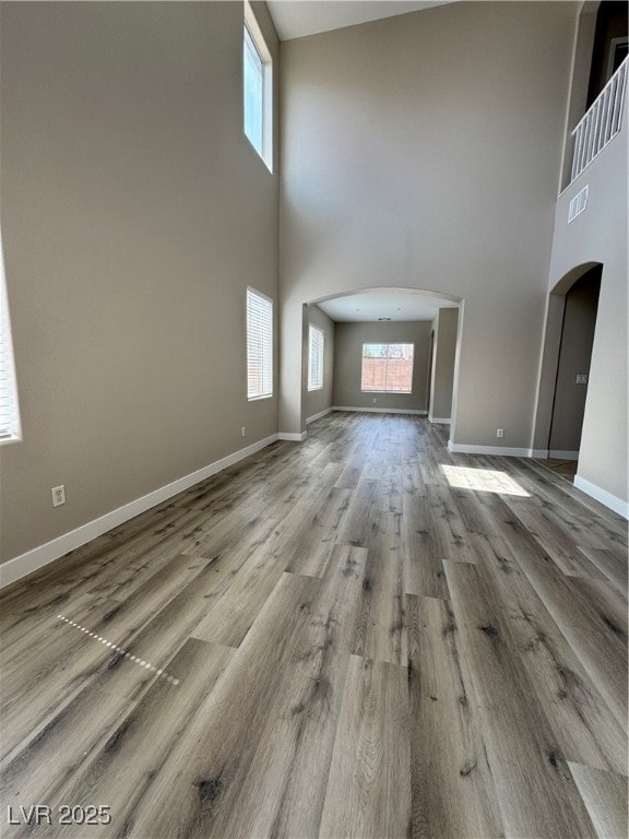 Unfurnished living room featuring baseboards, visi