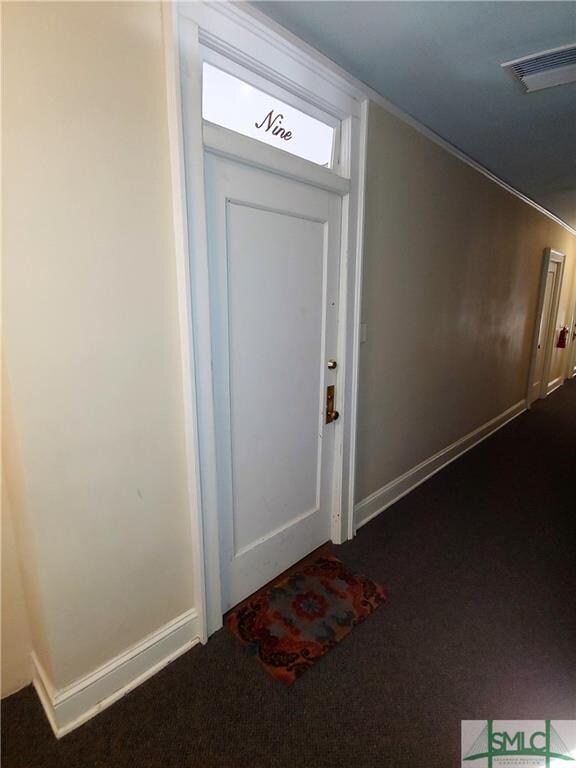 The condominium has two entry doors, one leading i