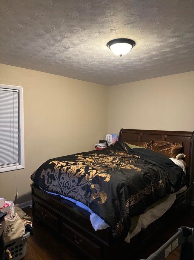 Bedroom featuring a textured ceiling