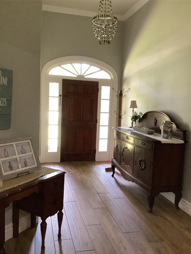 Elegant foyer seamlessly flows into the spacious l