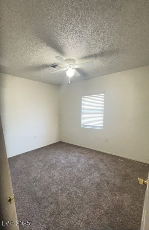 Carpeted bedroom a ceiling fan.