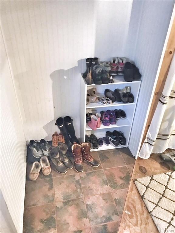 Kick your shoes off in this finished mudroom area.