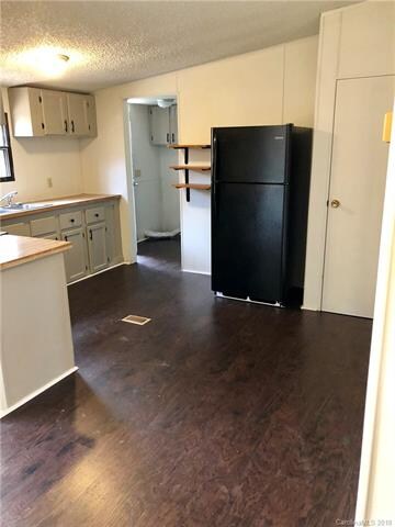 New flooring in Kitchen & new black appliances.  2