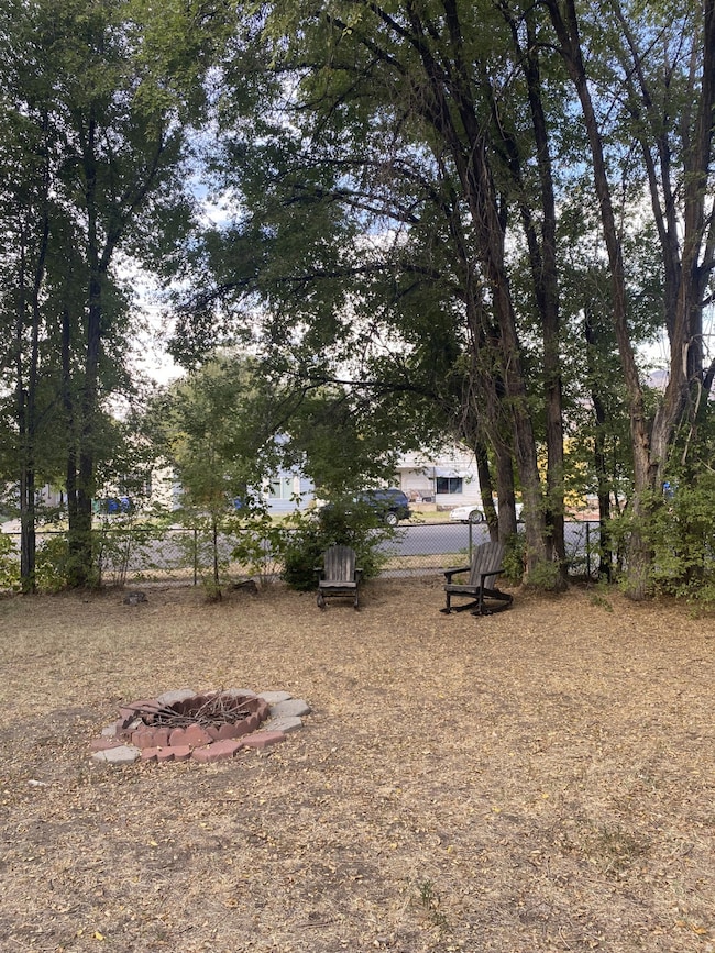 View of yard featuring a fire pit. Yard, North side