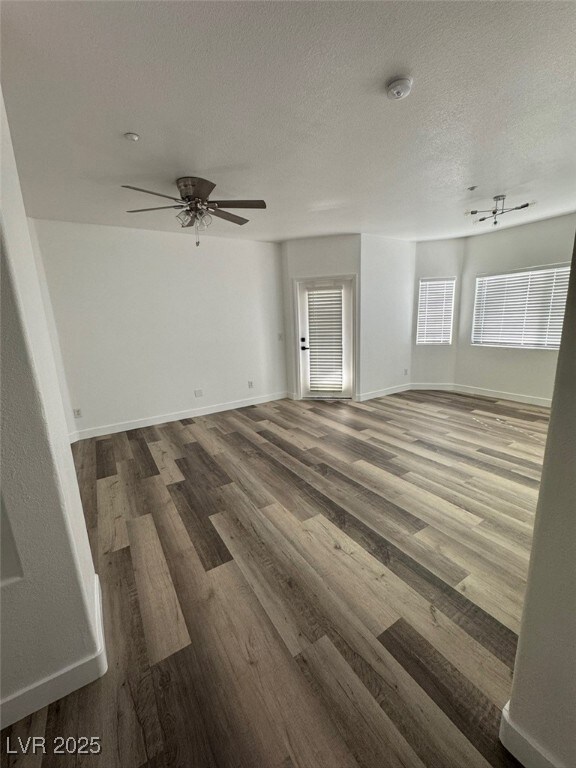 Spare room featuring a smoke detector, wood finish