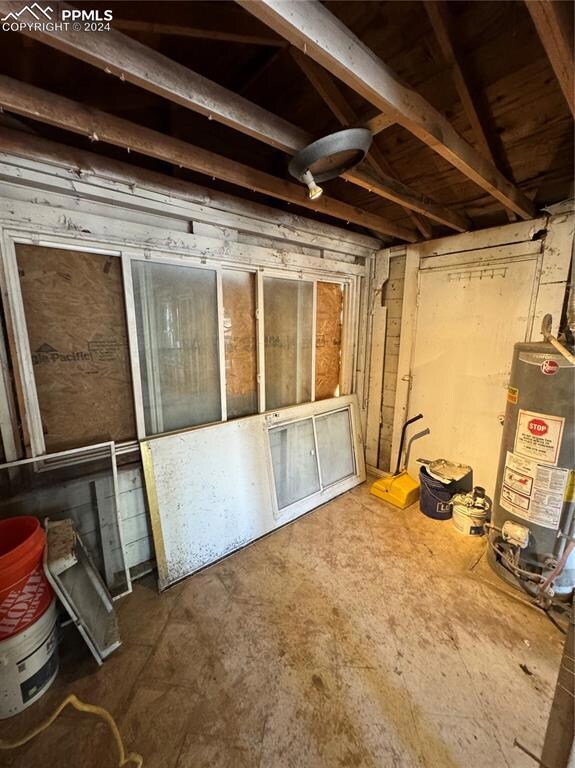 Basement featuring water heater