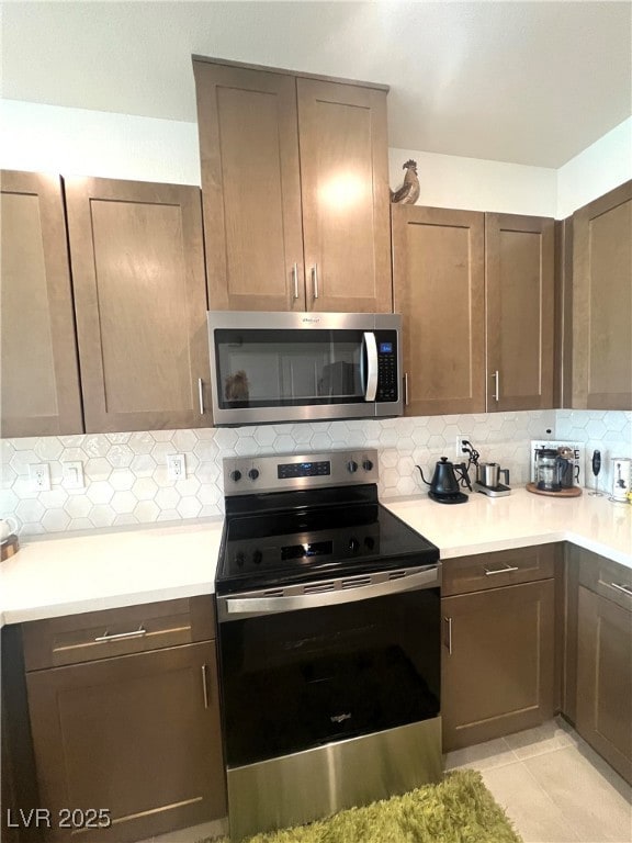 Kitchen featuring appliances with stainless steel