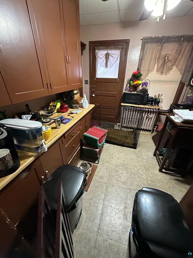 Kitchen featuring light countertops