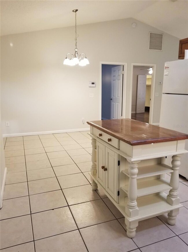 View from the kitchen into your Dining Room or office. Bedrooms ahead thru the doors