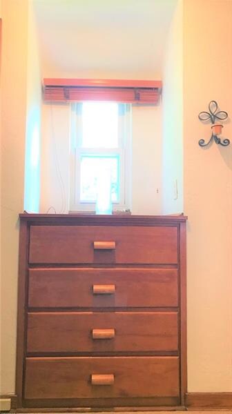 Built ins flanked by storage/linen closets