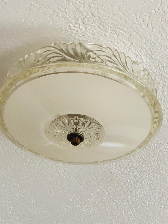 Vintage glass light fixture in the dining room.