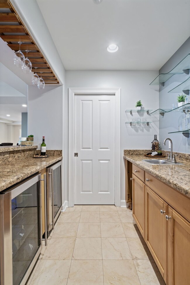Peek into the wet bar—a sleek and stylish space de