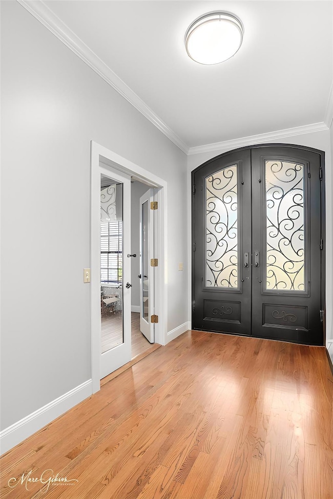 Foyer entrance featuring french doors, ornamental 
