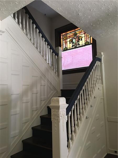 Beautiful Victorian-style staircase with refinishe