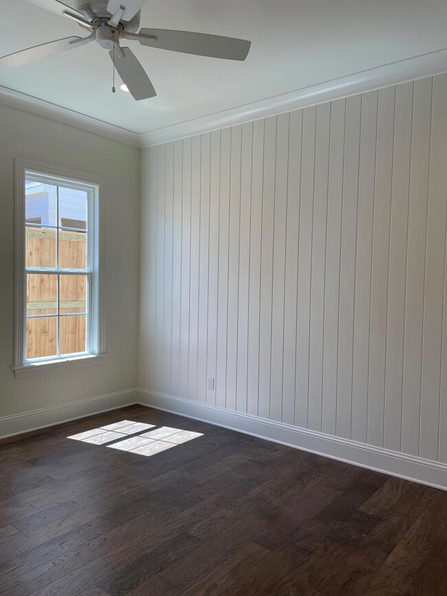 Main bedroom has accent wall, cove crown, and engi