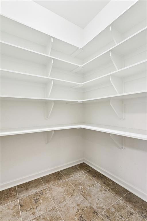 Pantry: Walk-in - Tile Flooring - Wood Shelving